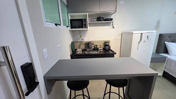 Fridge, microwave, stovetop, coffee/tea maker