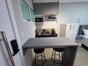 Fridge, microwave, stovetop, coffee/tea maker