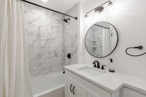 Hair dryer, towels, soap, shampoo