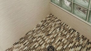 A room with a tiled floor, a window with green-tinted glass, and a patterned wall. - Tranquil - 2 bedroom cabin in charming Trinity Center awaits you (Trinity Center)
