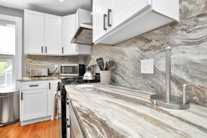 Microwave, oven, stovetop, dishwasher - 4BD 2BA Spacious Duplex W/Parking. Walking Distance to MBTA & Restaurants (Boston)