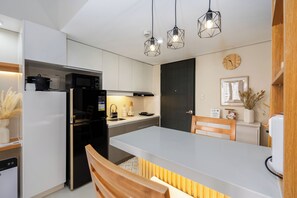 Fridge, microwave, stovetop, coffee/tea maker