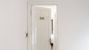A white door with a number plate indicating room 502. - Better Home Hanoi (Hanoi)