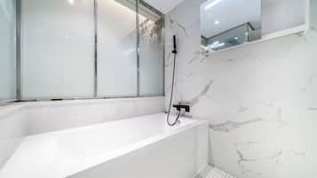 Deluxe Double or Twin Room, Shower Grab Bars, Private Bathroom | Bathroom | Hair dryer, towels, soap, toilet paper