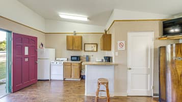 Fridge, microwave, coffee/tea maker, cookware/dishes/utensils