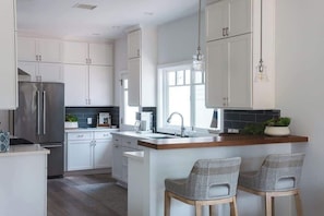Fridge, microwave, stovetop, coffee/tea maker