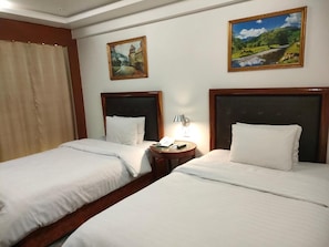 Chambre Standard, vue ville | Fer et planche à repasser, Wi-Fi gratuit