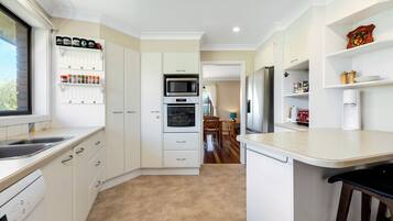 Coffee/tea maker, fridge, microwave, oven