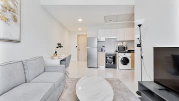 Exklusiv lägenhet - balkong - utsikt mot staden | Vardagsrum