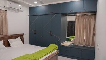 Family Apartment, Balcony, City View | In-room safe, desk, laptop workspace, blackout curtains