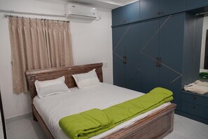 Family Apartment, Balcony, City View | In-room safe, desk, laptop workspace, blackout drapes