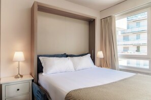 Deluxe Studio, City View | Living area | Flat-screen TV