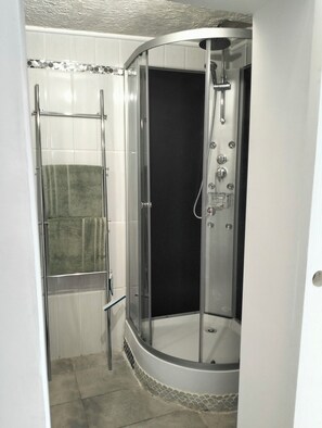 Shower, towels, soap, toilet paper