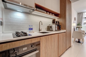 Exclusive Studio, Balcony, Pool View | Private kitchen | Full-size fridge, microwave, oven, stovetop