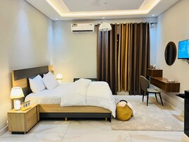 Deluxe Suite, 3 Bedrooms, Housekeeping, Hill View | Desk, laptop workspace, iron/ironing board, free WiFi