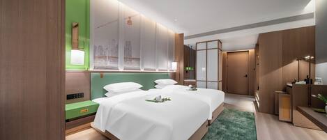 A modern hotel room with two beds, a green accent wall, a large window, and a separate bathroom area.