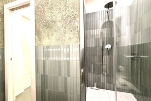 Shower, hair dryer, bidet, toilet paper