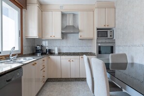 Fridge, microwave, dishwasher, coffee/tea maker
