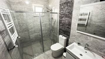 Shower, eco-friendly toiletries, hair dryer, towels