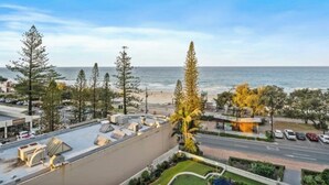 A coastal hotel with a rooftop terrace, a parking area, and a view of the beach and ocean. - The Sands Beachfront city centre (Surfers Paradise)