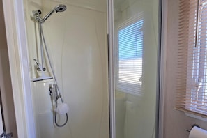 Shower, towels, toilet paper