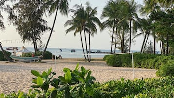 On the beach, sun loungers, beach umbrellas, beach bar