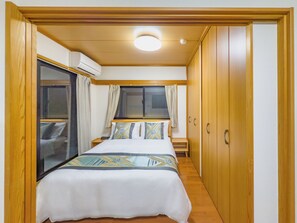 Family Suite, Balcony, City View | Desk, laptop workspace, free WiFi