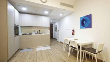 Apartment, Balcony, City View | Private kitchen | Full-size fridge, microwave, oven, stovetop