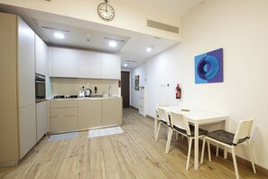 Apartment, Balcony, City View | Private kitchen | Full-size fridge, microwave, oven, stovetop