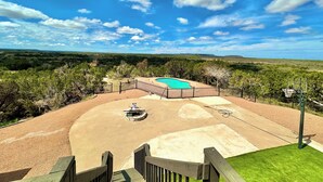 A pool area with a clear view of the surrounding landscape.