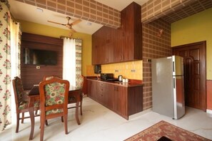 Fridge, microwave, electric kettle, cookware/dishes/utensils