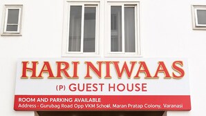 A guest house named Hari Niwaas with a sign indicating room and parking availability. - Hari Niwaas Guest House by VM Stays (Varanasi)
