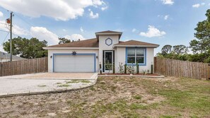 A single-story house with a garage, a small porch, and a fenced yard. - Lrw503 (Nokomis)