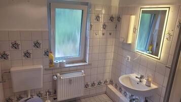 Shower, towels, soap, toilet paper