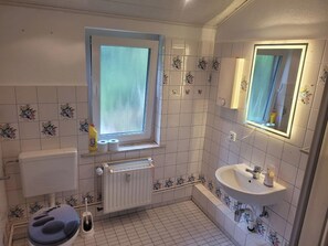 Shower, towels, soap, toilet paper