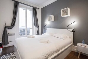 Departamento | 1 habitación, tabla de planchar con plancha y ropa de cama 