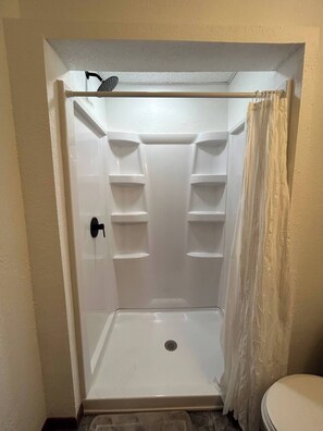 Shower, towels, soap, toilet paper