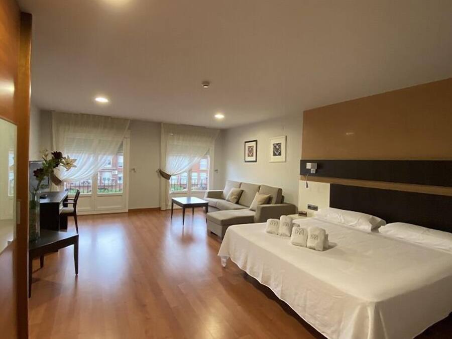 Deluxe Suite, Balcony, City View | Premium bedding, in-room safe, desk, laptop workspace