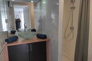 Shower, hair dryer, towels, soap