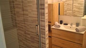 Shower, hair dryer, towels, soap