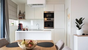 Coffee/tea maker, fridge, microwave, oven