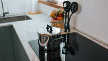 Fridge, dishwasher, coffee/tea maker, cookware/dishes/utensils