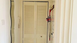 A closed door with a keyhole and a small keyhole lock.