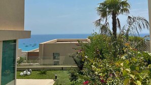 A modern building with a view of the sea.