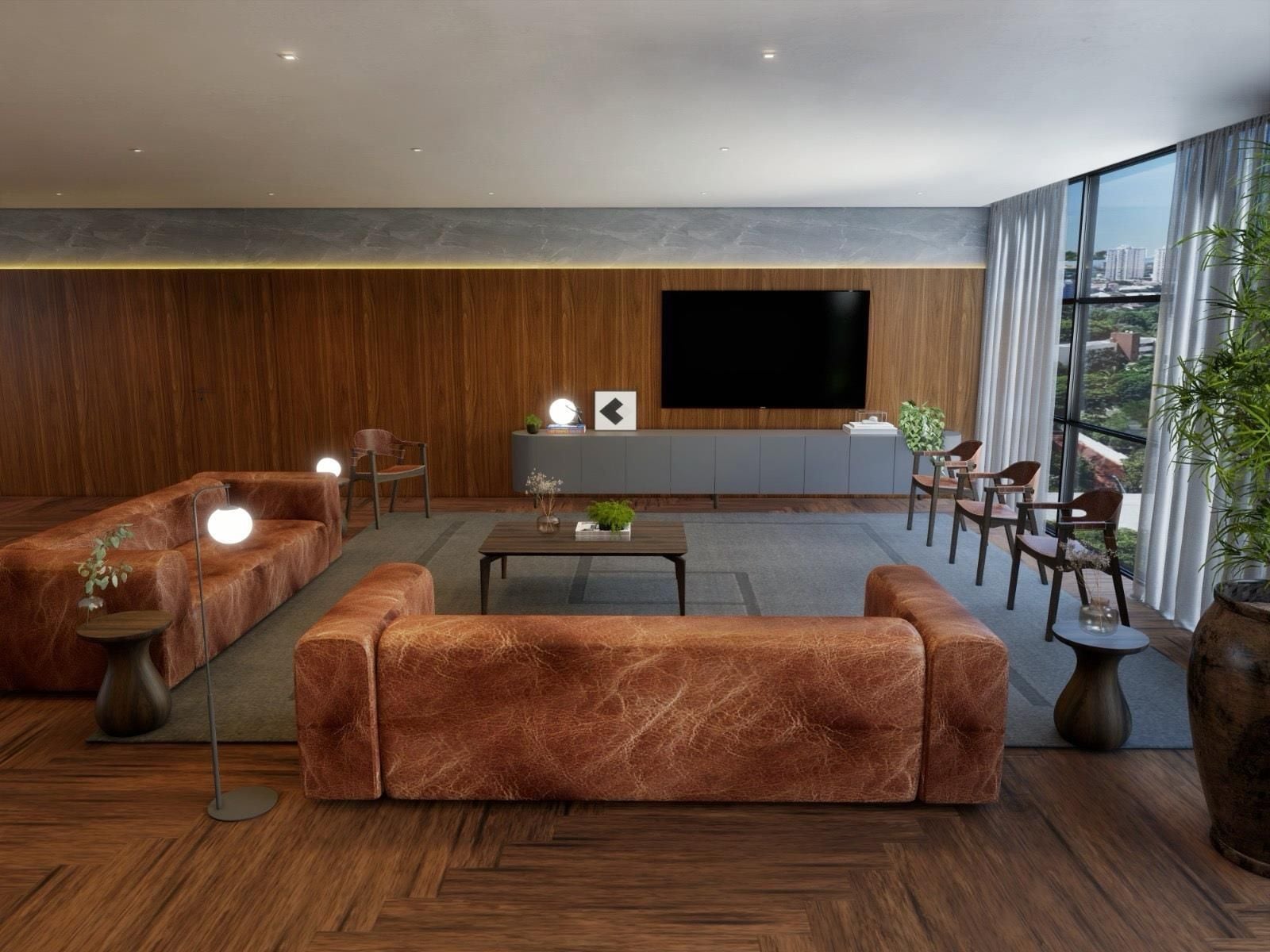 A modern living room with a large flat-screen TV, wooden panel walls, and a view of the city through large windows.