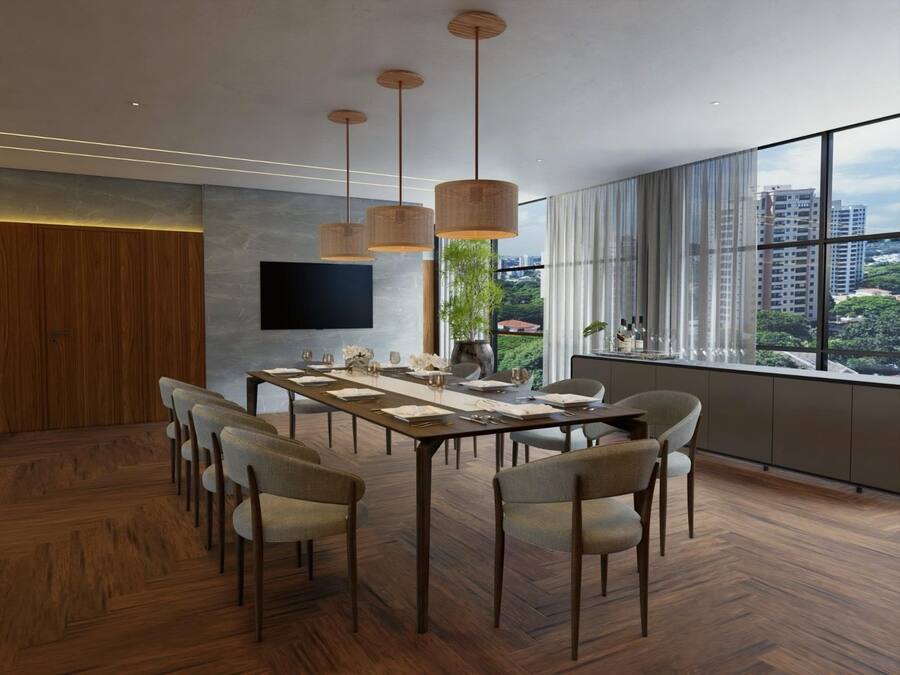A modern dining room with a long table, multiple chairs, hanging light fixtures, a flat-screen TV, and a large window with a city view.