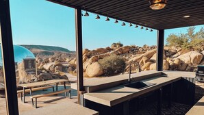Terrace/patio - Iconic 7,000sf Glass Villa w/ 2 Pools on 350 Acres (Pioneertown)
