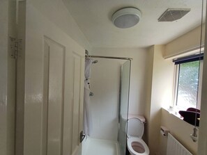 Shower, deep soaking tub, towels