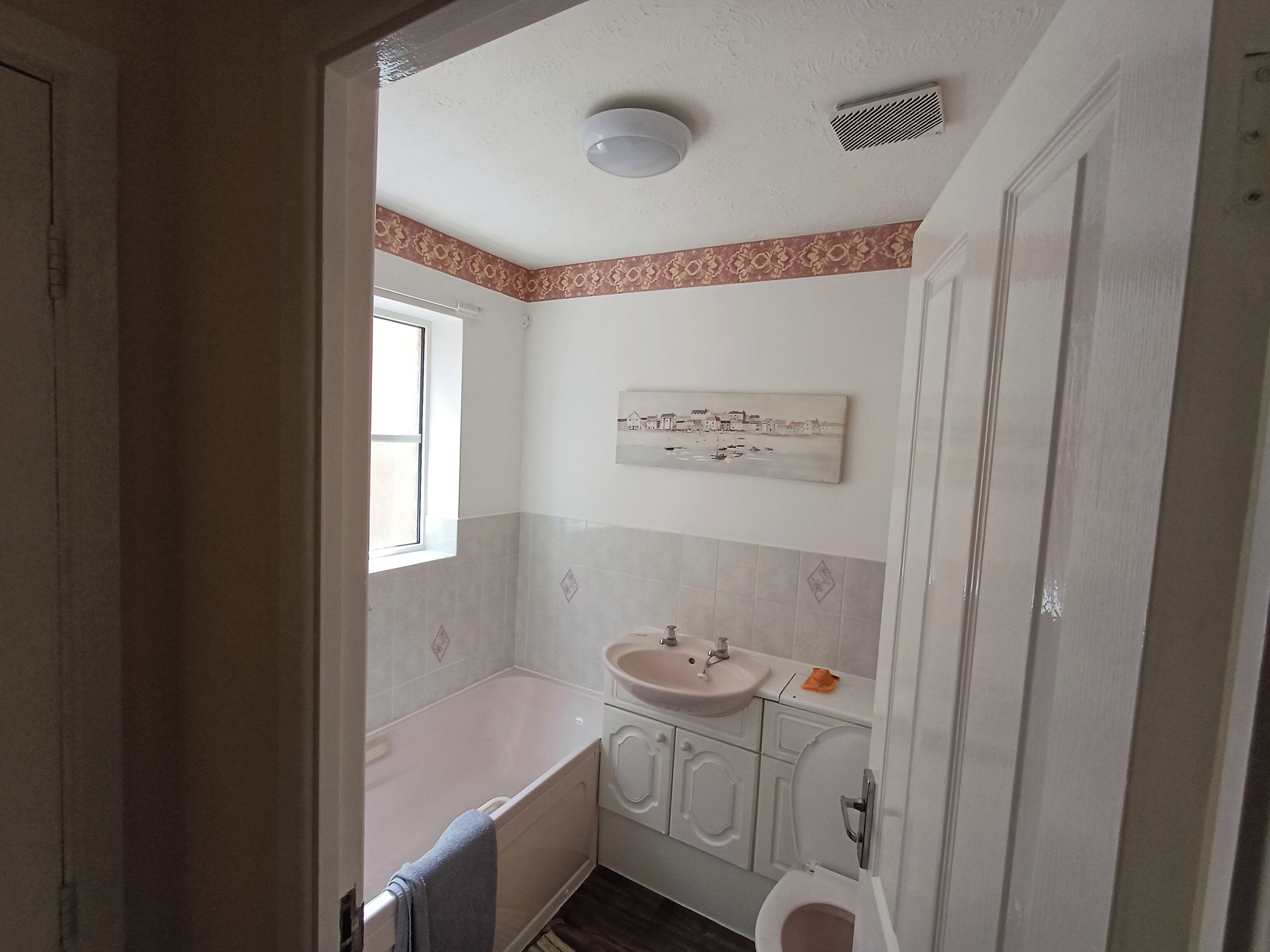 Shower, deep-soaking bathtub, towels