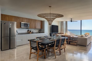 Deluxe Apartment, Beach View | Private kitchen | Full-size fridge, microwave, cookware/dishes/utensils